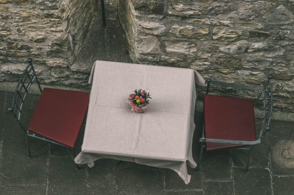A simple table for two at an outdoor restaurant near the coast