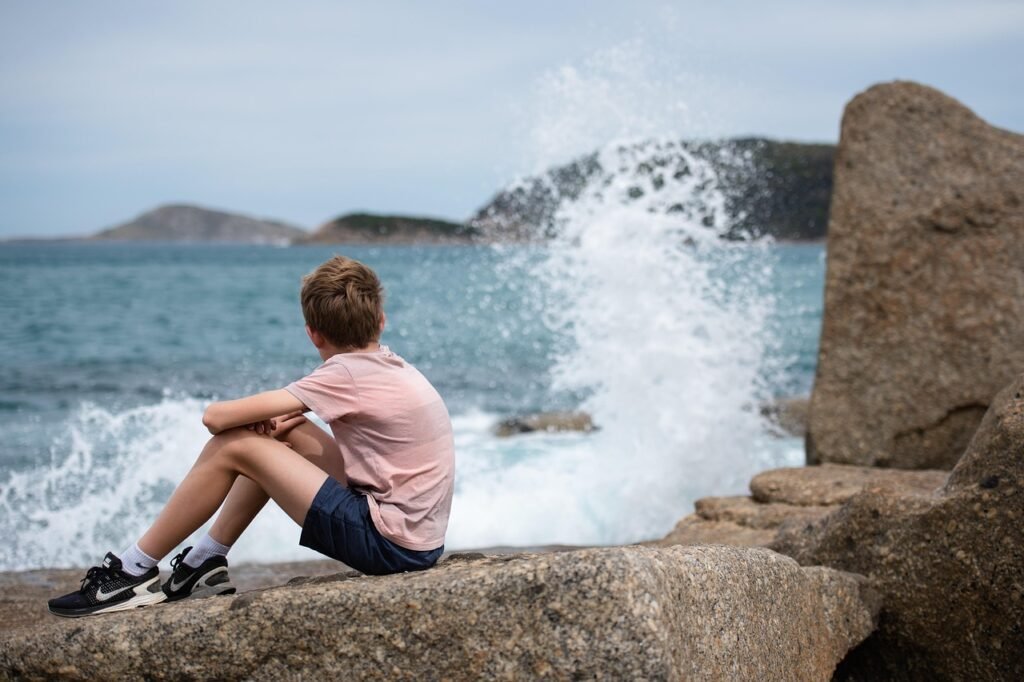 ocean, sea, coastline, waves, water, seascape, coast, outdoors, boy, watching, nature, thinking, rocks