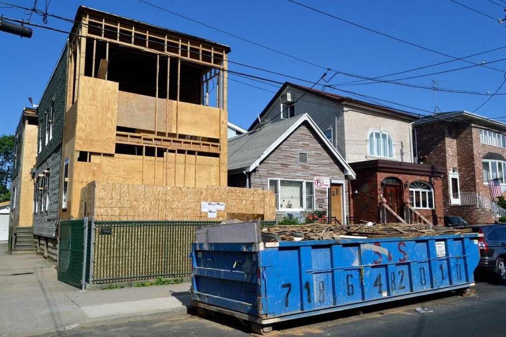 house, under construction, construction, men at work, dumpster, garbage, trash, demolition, trash removal, property, housing,