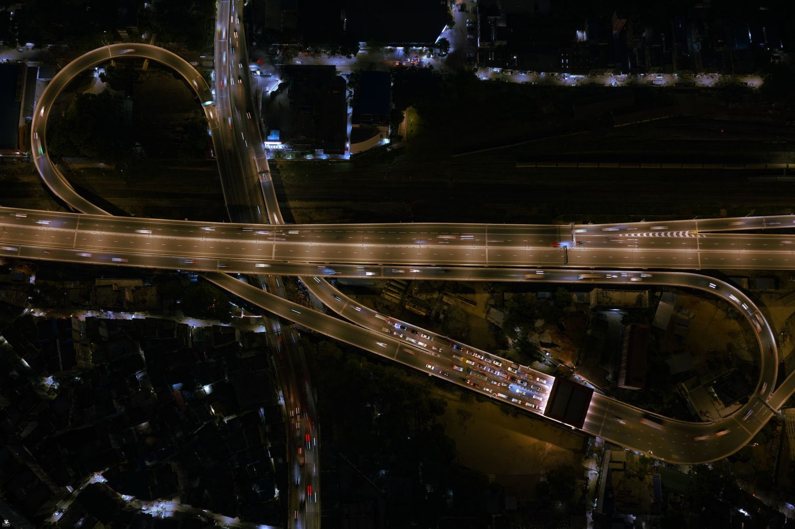 A stunning aerial shot of a flyover highway in Dhaka, Bangladesh at night.
