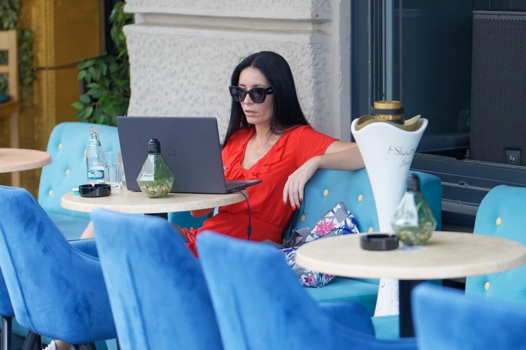 woman, work from anywhere, cafe, working, casual, sunglasses, stand, outdoor, laptop, remote work, lifestyle, remote work, re
